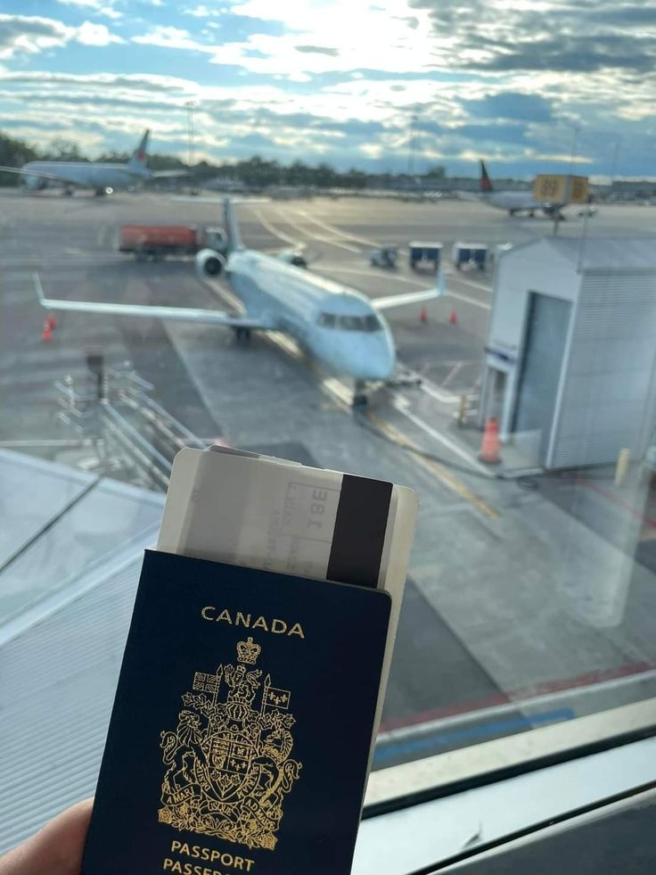 Canadian passport and travel papers pictured during a journey